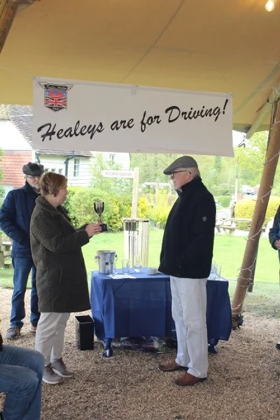 Anne Edwards presents the Derek Edwards Drive It Trophy to Ed Friend, 16th April 2024. Ed has documented over 100,000 miles driven in his 3000, mostly in Scotland, France, and Switzerland