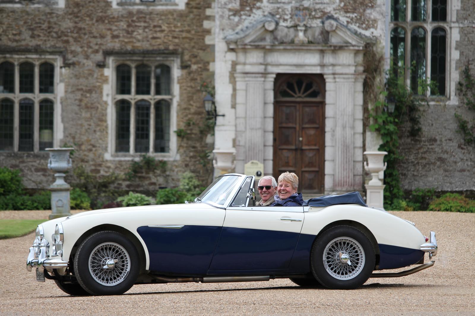 Dave and Angela in their 1963 Austin Healey 3000 Mk11 BJ7 outside Loseley Hall near Guildford